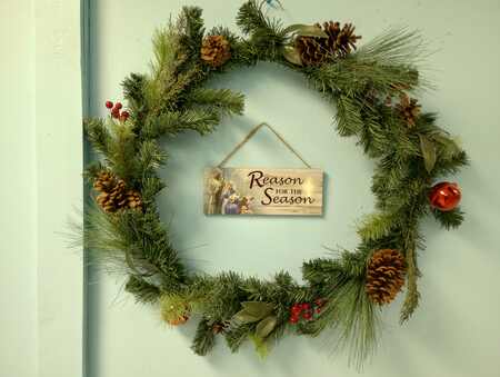 A wreath decorated for the Christmas season inside the church.